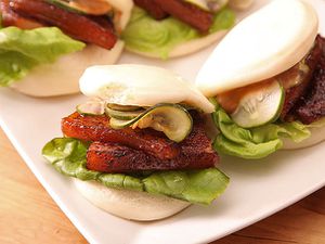 Sous vide pork belly steamed buns with lettuce and pickles