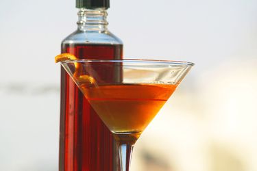 Bottle of DIY sweet vermouth and cocktail
