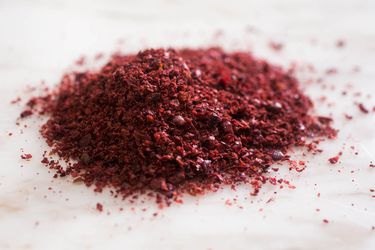 A pile of sumac on a countertop.