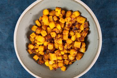 Overhead view of roasted butternut squash in a bowl